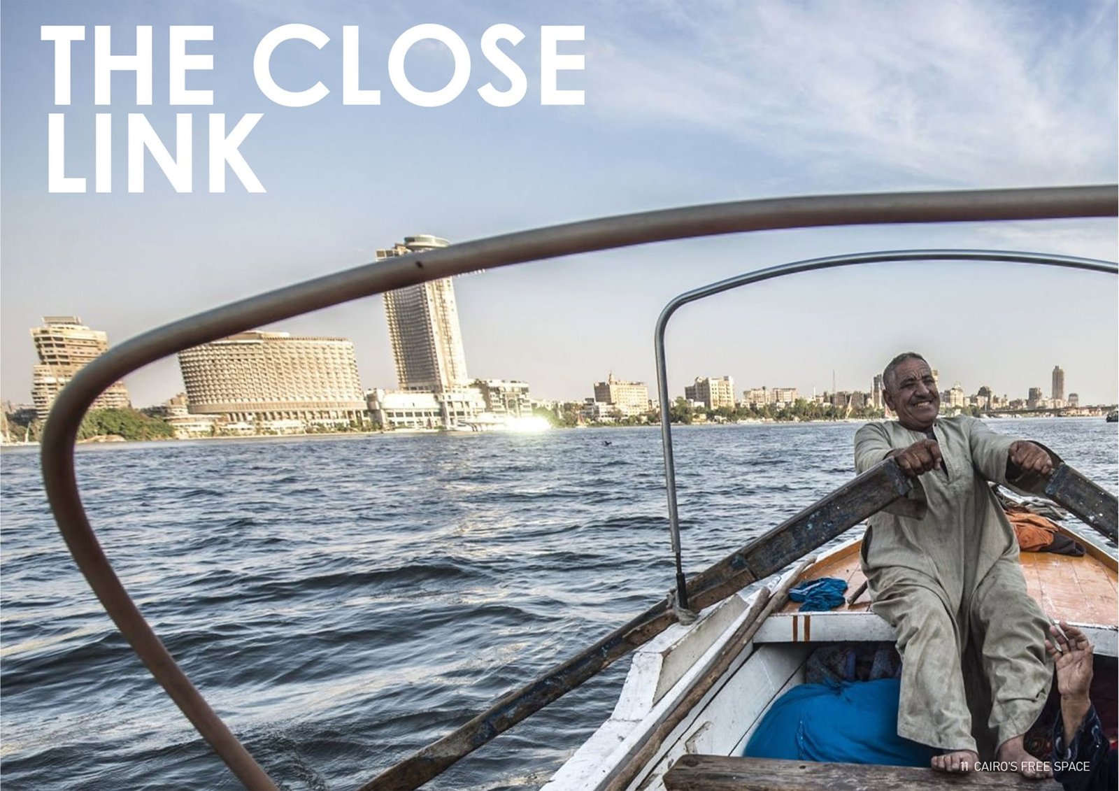 Riverboat photograph looking toward Cairo buildings across the Nile.