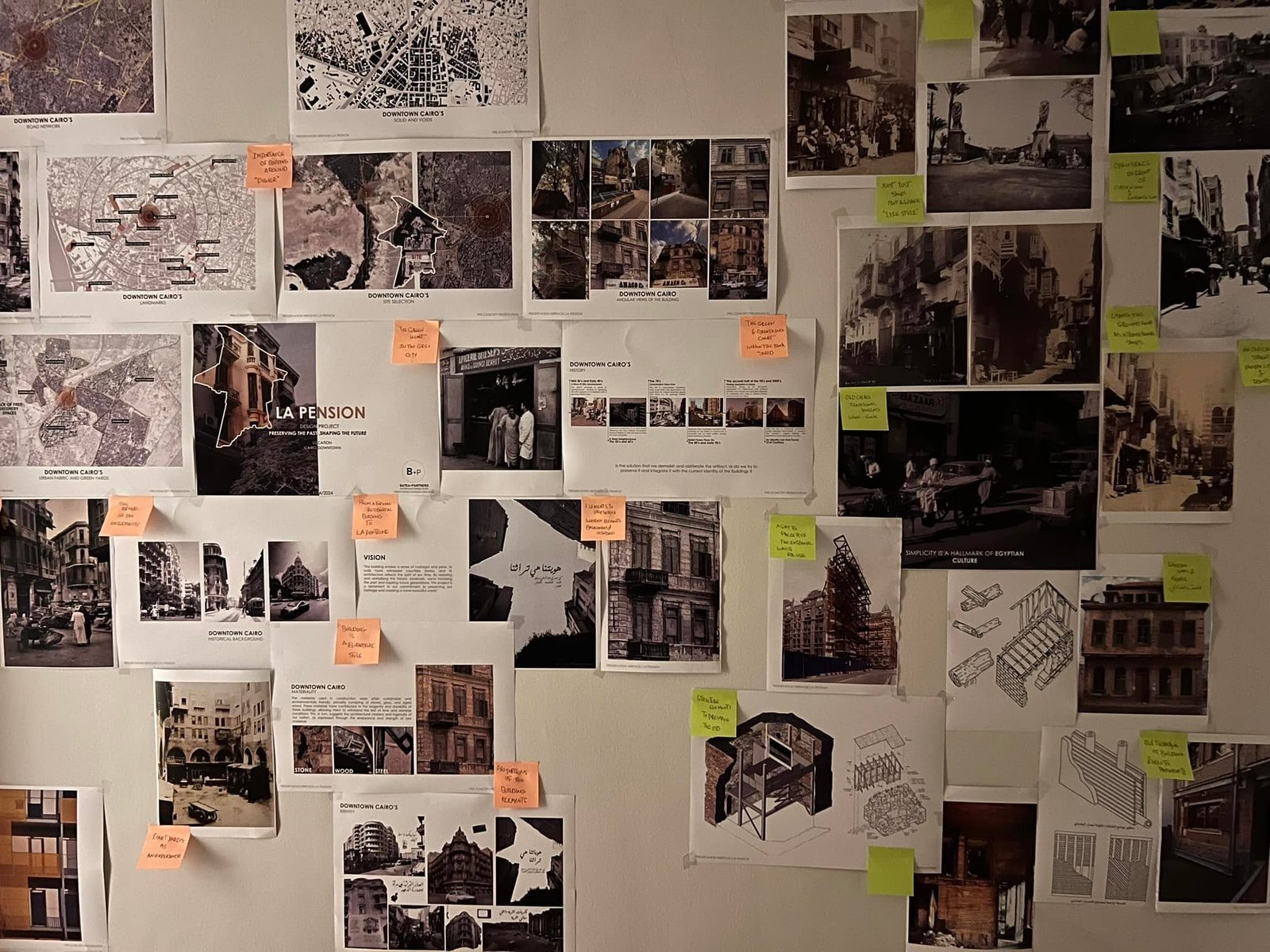 Frontal view of the La Pension research wall with maps, photographic references, project diagrams and annotated presentation sheets.
