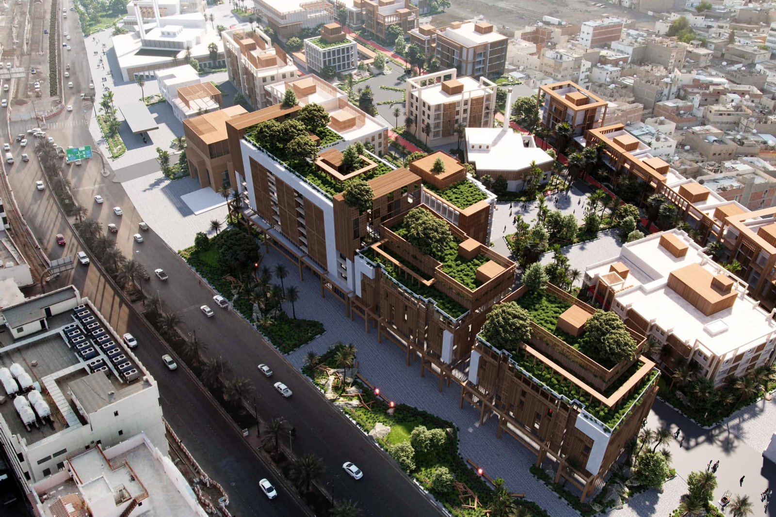 Aerial visualization of Nawat Al-Madinah redevelopment with screened buildings, planted terraces, pedestrian spaces and surrounding city streets.