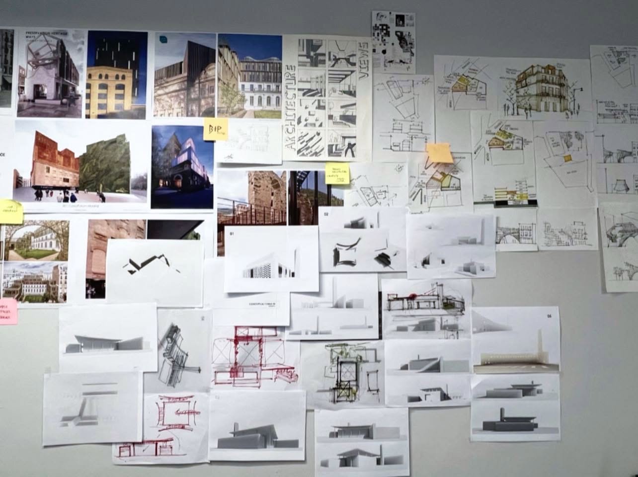Studio brainstorming wall covered with architectural reference images, hand sketches, site drawings, massing studies, and sticky notes.